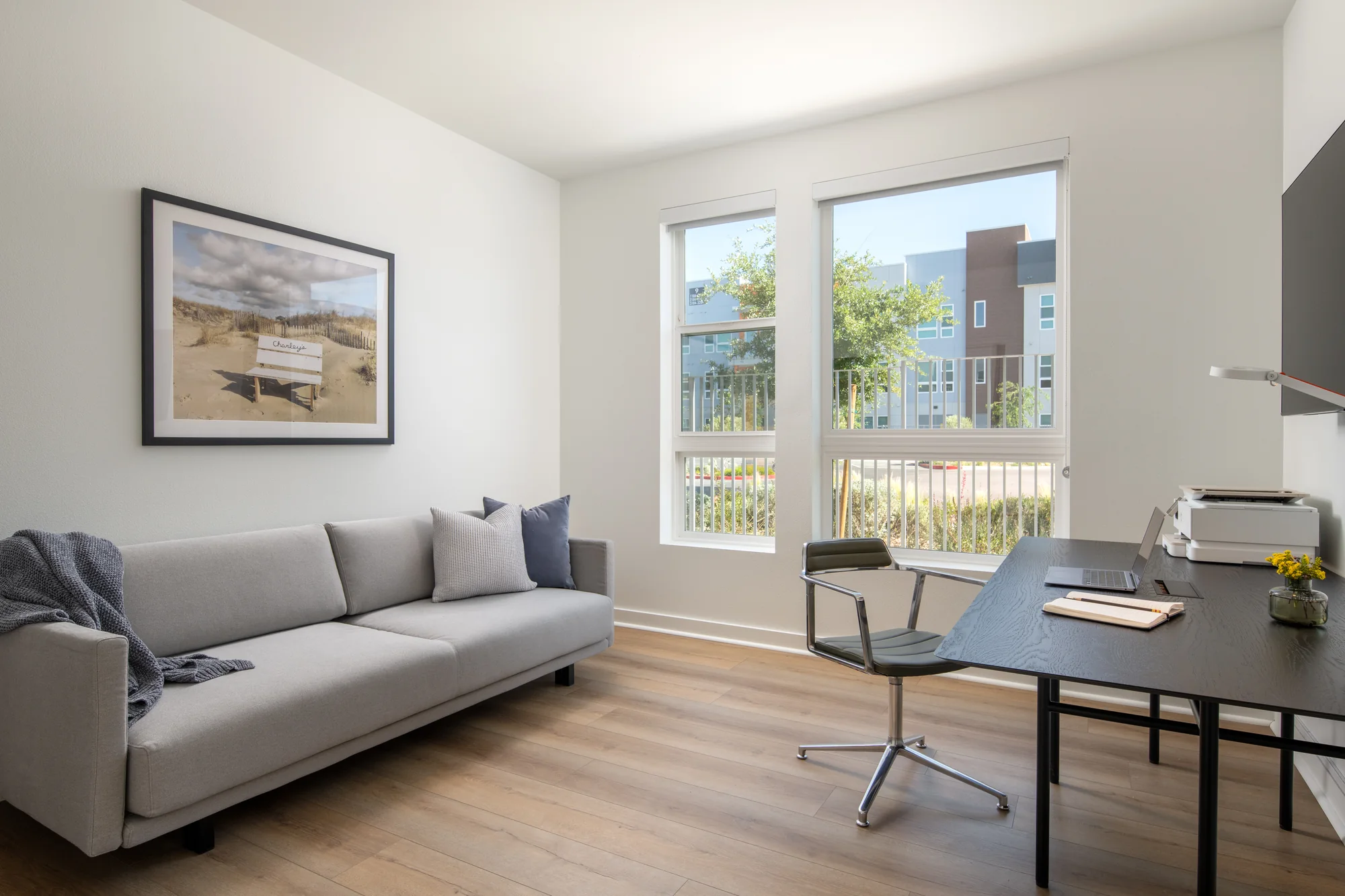 Office with sleeper sofa in the Executive One Bedroom at Ariva Serviced Residences