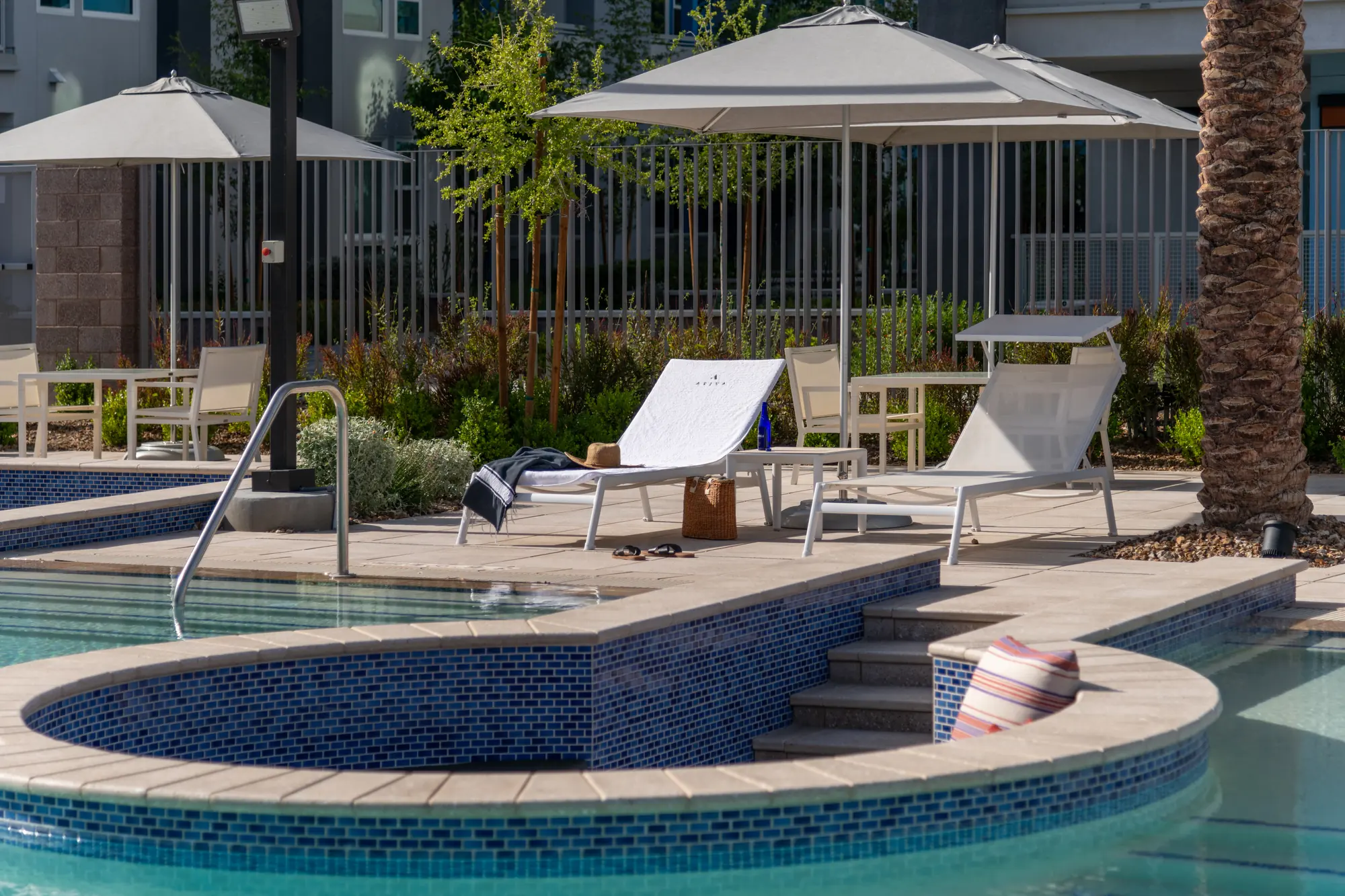 Poolside loungers at Ariva Serviced Residences