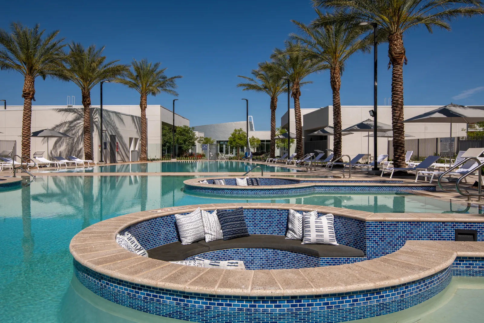 Resort-style pool and cabanas at Ariva